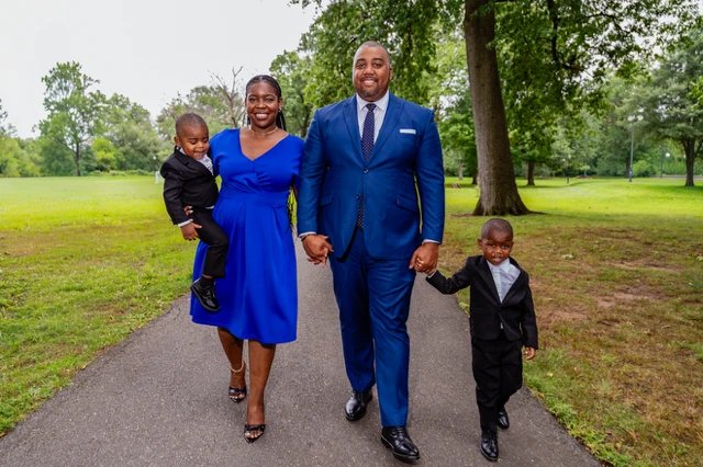 Justin Randall Brown walking with his family